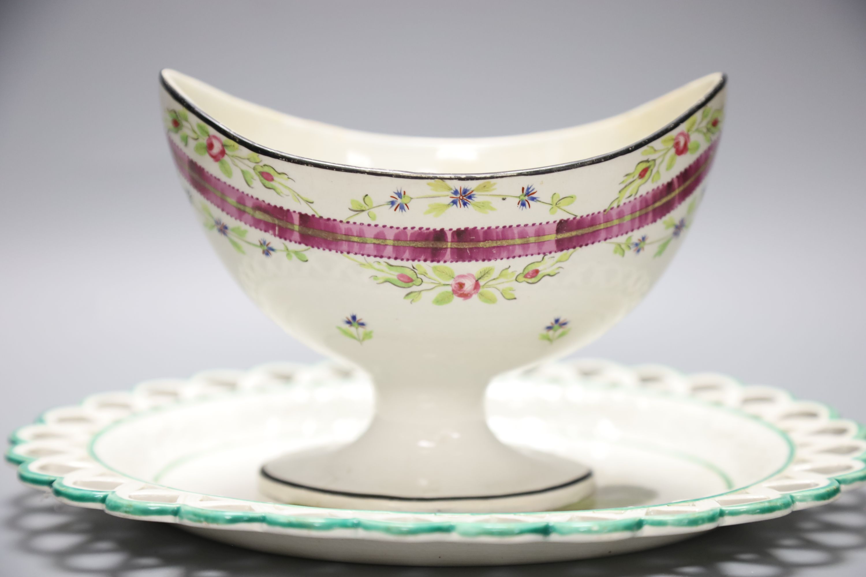 A 19th century creamware sugar bowl and a similar Wilson oval stand, longest 26cm